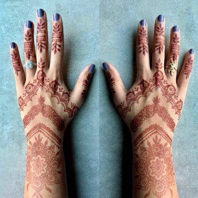 Henna art on 2 full hands