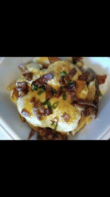 Comfy fries, bed of fries topped with cheese, bacon, eggs and chives