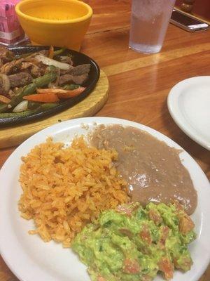 Small sample of rice beans and guacamole not a side persay.