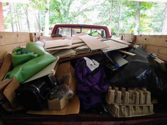 Junk Removal with our cool F150 Dump Truck...