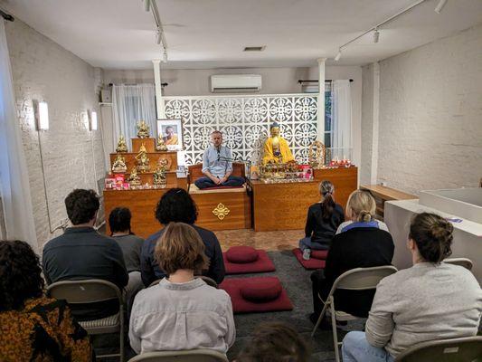 A typical class at KMC BK. A teacher leading a meditation, followed by a discussion.