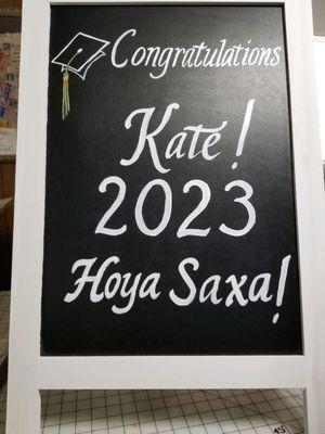 Graduation party sign on customer supplied board.