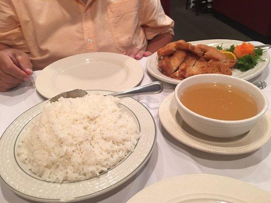 This is a picture of the lemon chicken, white rice and lemon sauce