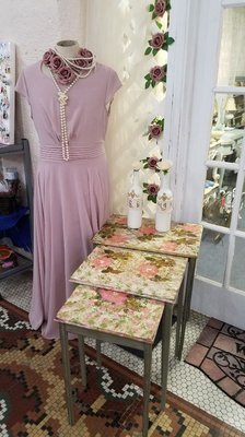 3 vintage nesting tables that have been painted and decoupaged