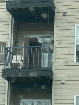 My $900 couch sitting outside in the rain.