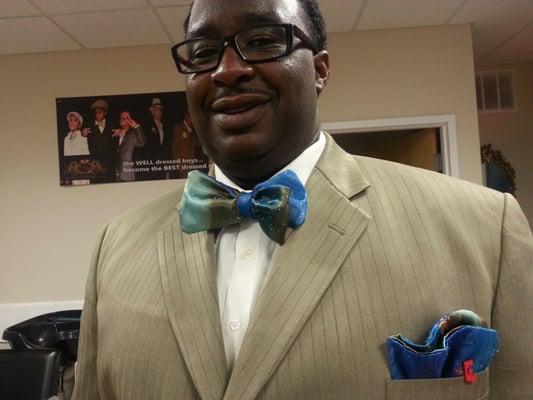 Ernie Doggett lll, President of African American Firefighters Association. Picks up a custom made Blue/ Brown Bow Tie