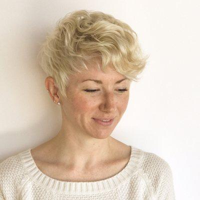 A short razor pixie and a curls make her texture pop