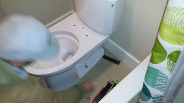 Jaime installing a new Toto toilet in my new home.