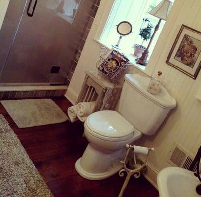 Rustic bath with custom steam shower.