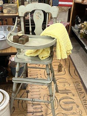 Adorable vintage high chair with original paint and decals. Perfect for your doll collection!