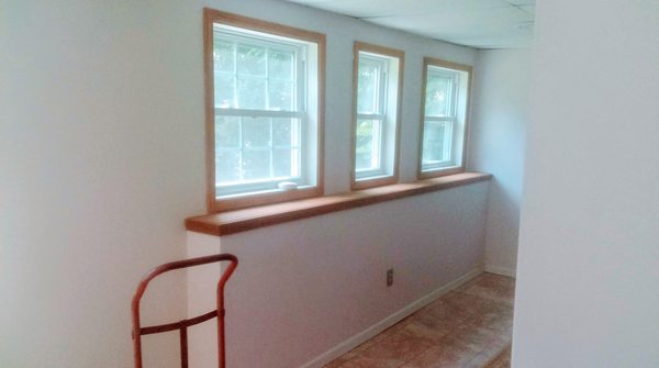 Windows where there were none, complete Basement remodel, with a floor tile, paint, and trim