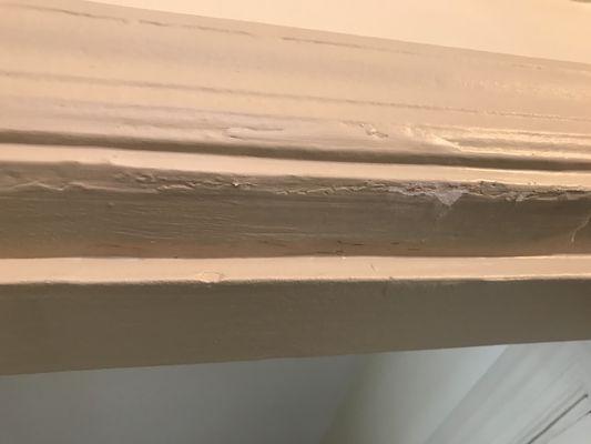 At least 15 layers of paint on door frames that make it so that the bathroom door doesn't actually close all the way.