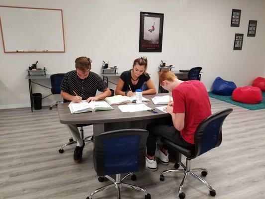 Students working at one of the conference tables.