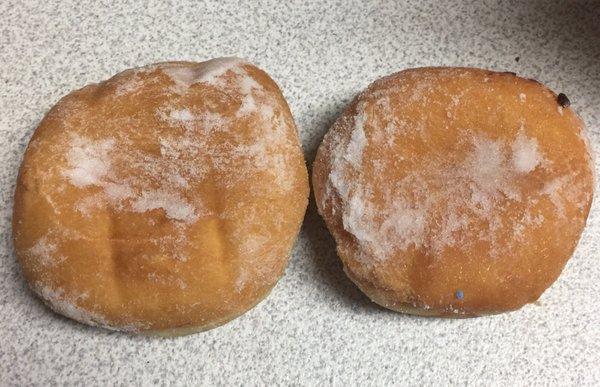 2 jelly donuts - one larger than the other.