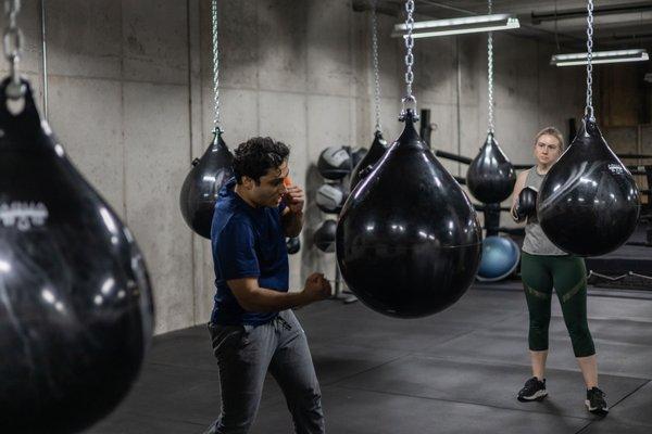 Canvas Club uses Aqua Bags which are heavy bags filled with water. They are easier on your wrists and shoulders.