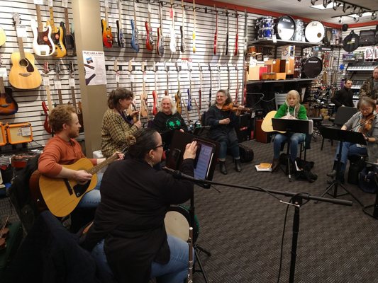 Open Mic hosted by M&A on St Patrick's Day turned into a folk jam session.