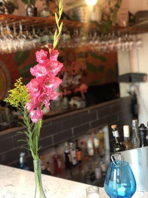 Flowers in entrance on the bar