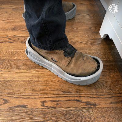 Our tech uses a shoe protector to help protect our customer's floors