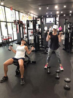 Two of our clients doing arm day together!