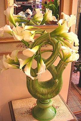 White calla lilies in unique vase