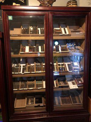 A well-stocked humidor full of fresh cigars.