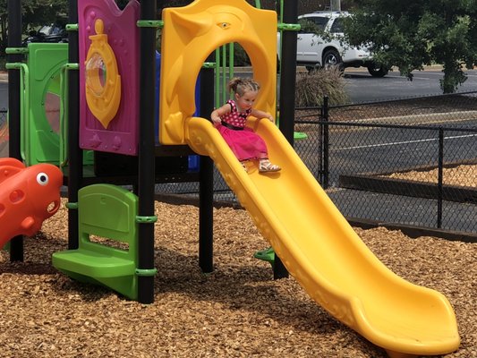 Time to slide on the playground at Kid City CDC