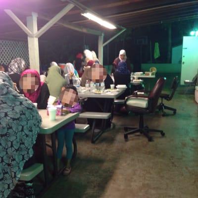 Outdoor eating section women's side. There were more people but some were inside for prayers.