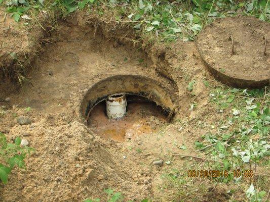 Septic Tank Lid Removed for Inspection and Sludge Test