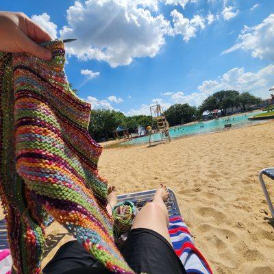 Knitting while at the beach club