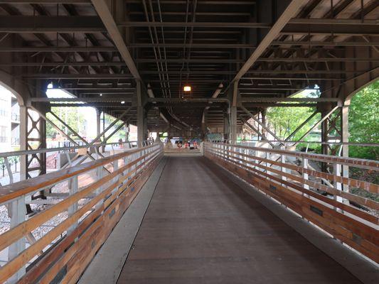 Swings from the park in view, at end of this Holton Street Bridge.