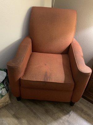 Stains on cushion and arms.