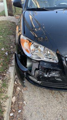 Broken headlight, damaged car