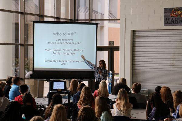 Speaking with students about college admissions.