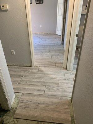 He made the floors seamlessly match through the condo, so there were no threshold transitions.