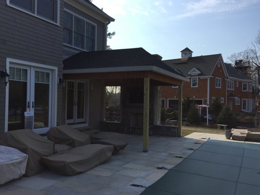 Covered porch with fireplace in Stamford, CT