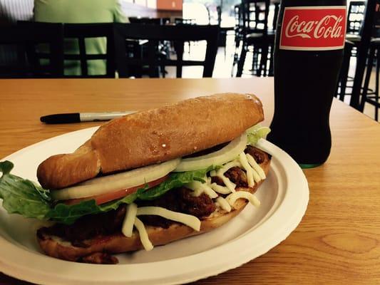 Come in and enjoy a torta de carne asada with a Mexican Coke!