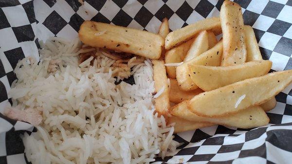 The rotisserie chicken came with a bit of rice and fries.