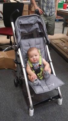 Trying out his new stroller in the warehouse!