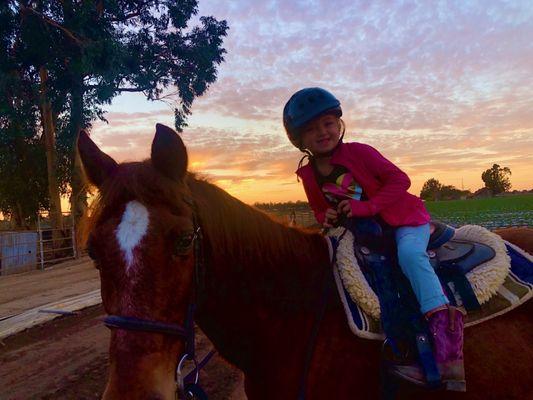 Sunset "cool down" ride after her riding lesson.