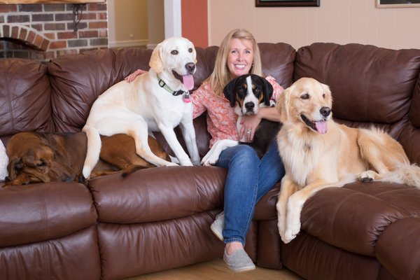 Sandy with some of our most frequent guests. Dogs are invited to sit with us on our leather furniture.