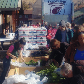 Residents Choose Fresh Produce at a Produce Tailgate Party