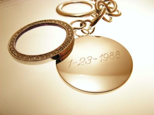 Lee Michaels charm that was engraved so that the date shows thru the floating bezel.