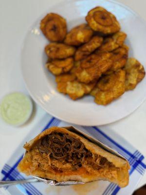 Pelua (shredded beef and cheese) arepa and plantains with green sauce - so good!