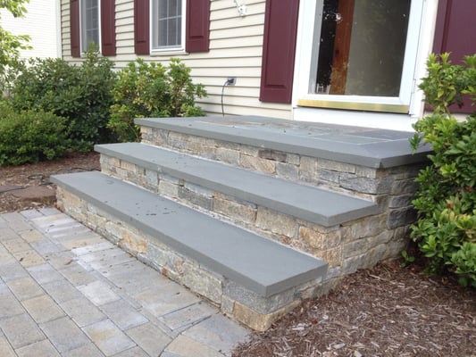 Front steps redo with bluestone treads, and natural stone veneers.