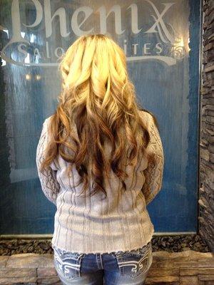 This style has been done by adding extensions to give the client much longer hair. The extensions are Donna Bella.