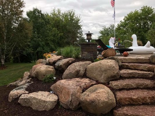 Natural 3 foot boulders and stairs.