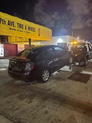 Sentra getting towed.