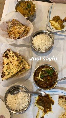 Top left is Goat Korma with onion Naan. The bottom is Goat Kadhai and Garlic Naan. Absolutely delicious.