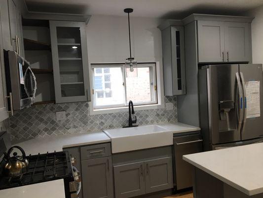 Light gray shaker, farmers sink is a nice touch to add into your kitchen.