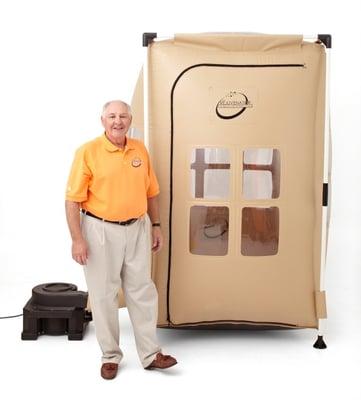 Inventor and CEO Hollis Risley stands beside The Rejuvenator.